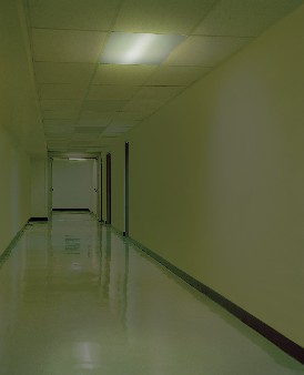 Emergency lighting ON. Corridor during power cut with emergency lighting in operation provided by a fluorescent emergency ballast. Image courtesy of Bodine.